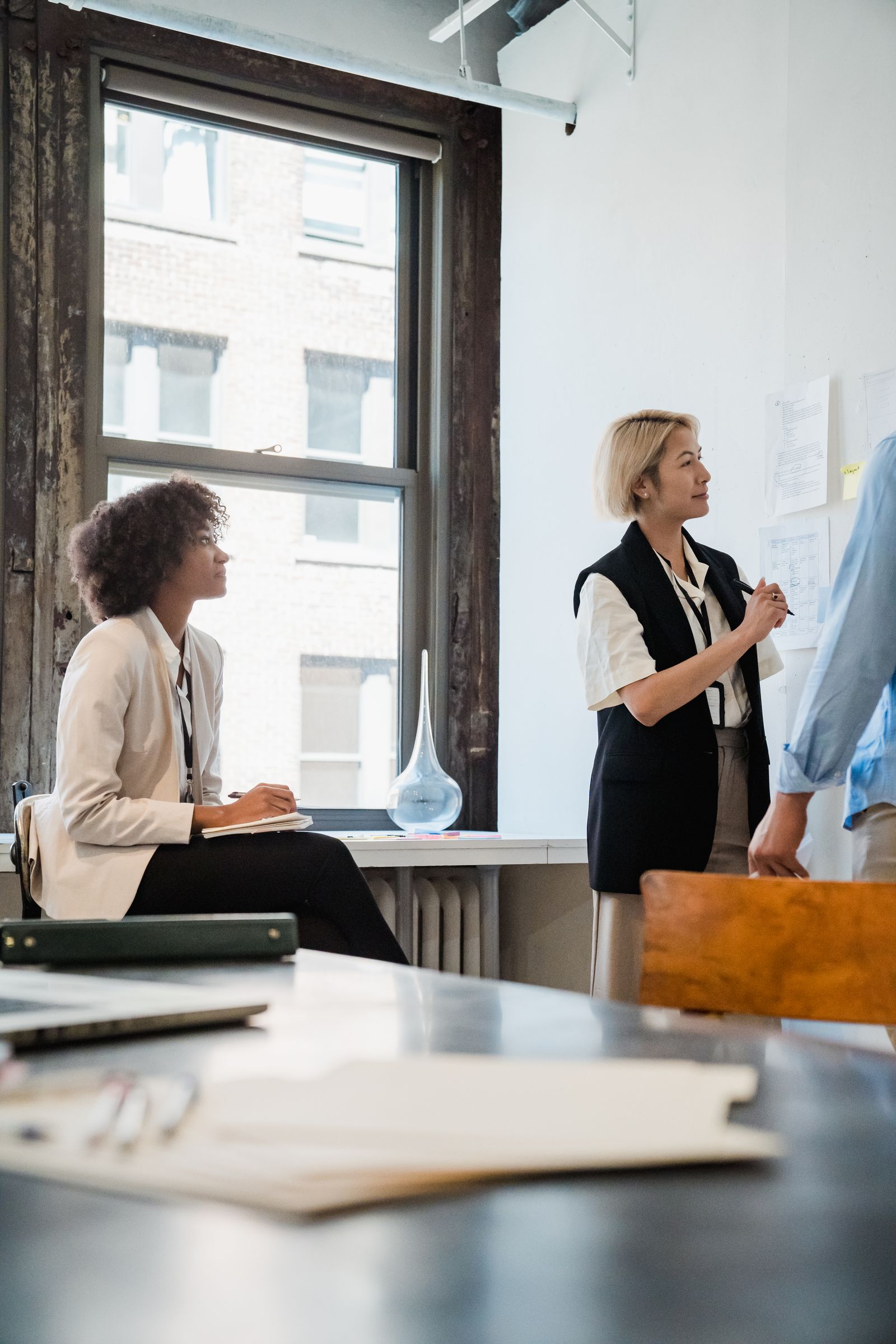 Professionals listening and working through ideas in a strategy session